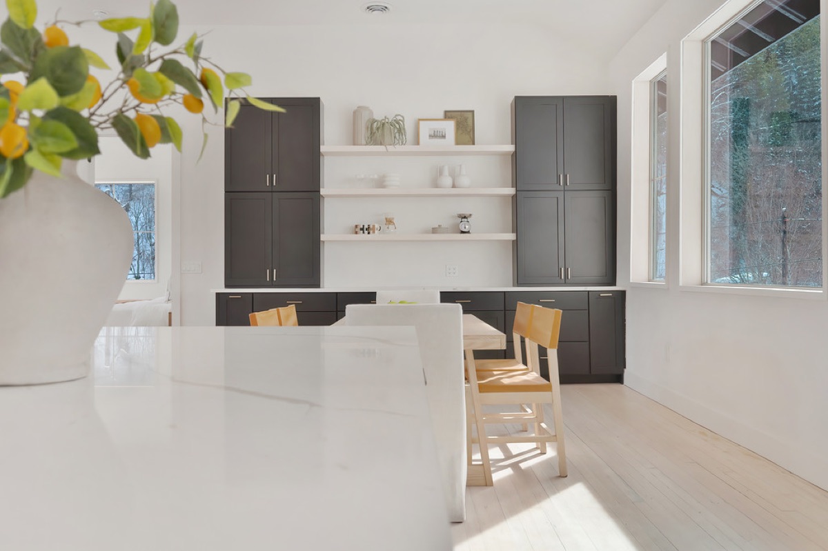 Custom kitchen and built-in dining nook finished for guest-ready living